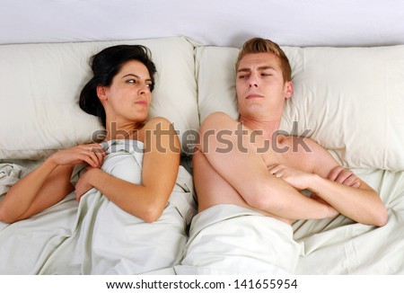 Anger couple fighting and discussing on bed.disagree couple on bed.