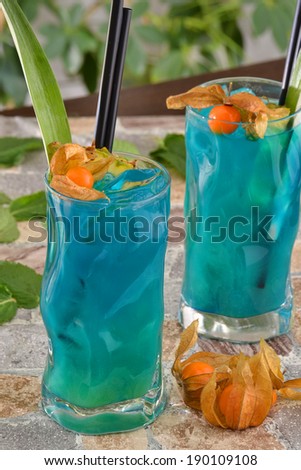 Cocktail drinks and fruits.Blue island cocktail.