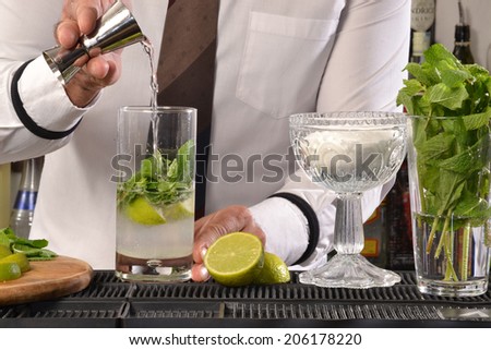 Barman preparing cocktail.Bartender preparing cocktail.