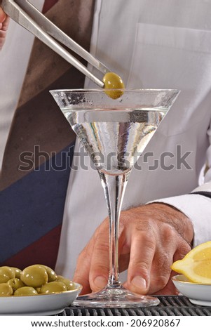 Bartender  preparing martini cocktail.Barman preparing cocktail