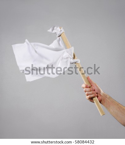 Male hand holding a white flag.