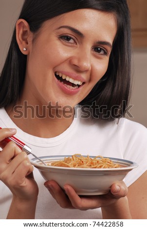 Young woman eating cereal corn.