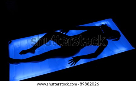 Water light bed woman relaxing.