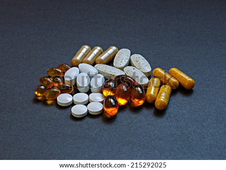 Various pills of vitamins and minerals.