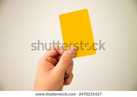 Similar – Image, Stock Photo Hand holds a yellow arrow with the word luck on it against a neutral turquoise background. Way to happiness.