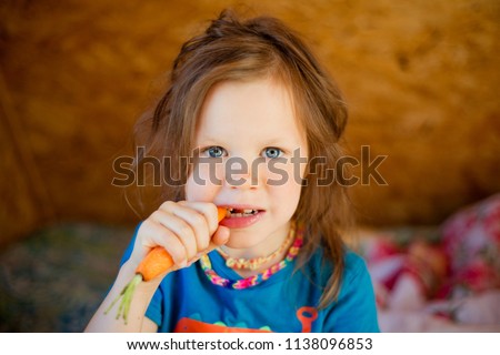 Image, Stock Photo Child eating fresh carrot