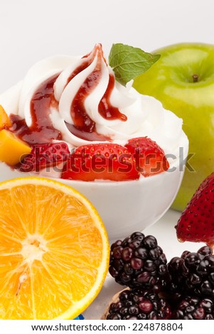 Yogurt ice cream with fresh fruits and marmalade