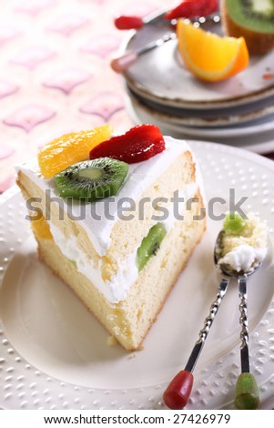 mix fruit chiffon cake, a delight dessert on a white plate. have it in a leisure time.
