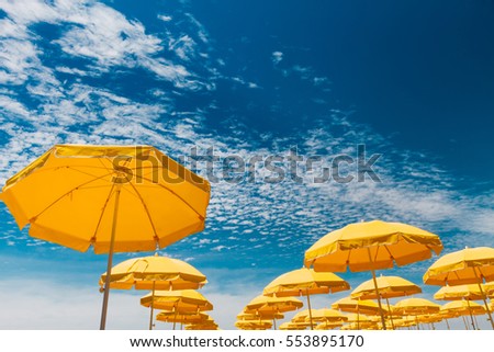 Similar – Foto Bild Gelber Sonnenschirm vor blauem Himmel. Sommer und Urlaub.