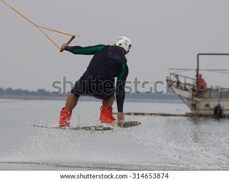 Lazurnoe , Ukraine, August 23, 2015:  Festival of music and sports Crayzy Day , Wakeboarder making tricks on sunset
