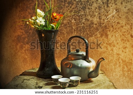 still life old ceramic vase on weathered wooden background