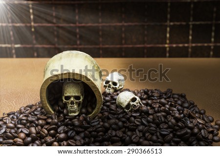 Skull in a bamboo cup placed on coffee beans., Still life photography style image blur.