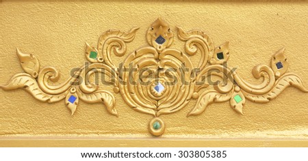 Engraving on plaster surfaces Photo-etched floral pattern shows in Thailand is very beautiful, delicate pattern Thailand attractive attractive as the temple walls.