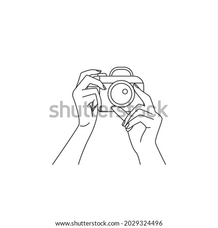 Hands holding camera outline vector illustration. Photo shoot contour design element. 