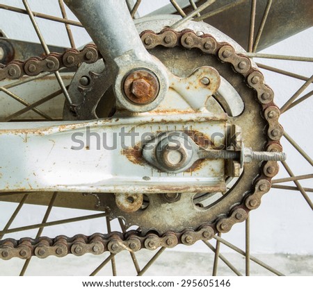 Old dirty motorcycle chain with rusty metal
