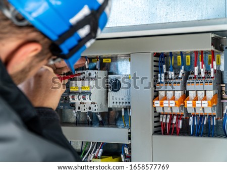 A engineer repairing electrical installation Photo stock © 