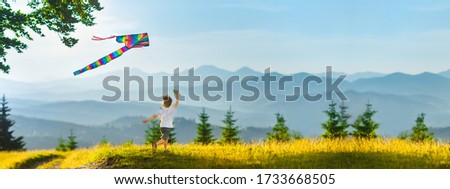 Similar – Image, Stock Photo Boy with striped kite on the beach in ICM technique.