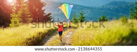 Similar – Image, Stock Photo Boy with striped kite on the beach in ICM technique.