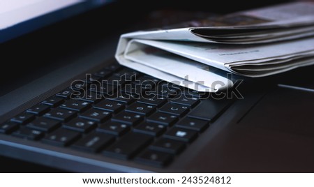 Newspapers and notebook