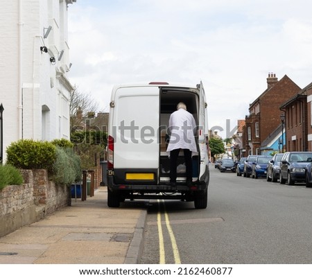 Van illegally parked on a double yellow line and obstructing the pavement for pedestrians. Photo stock © 