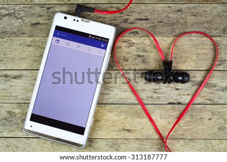 BUNG KAN, THAILAND - SEPTEMBER 02, 2015: Love facebook with earphones in heart shape, facebook music stream