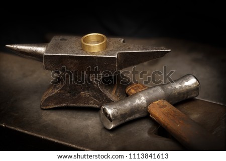 Image, Stock Photo Jeweler with hammer and chisel creating jewelry in workshop