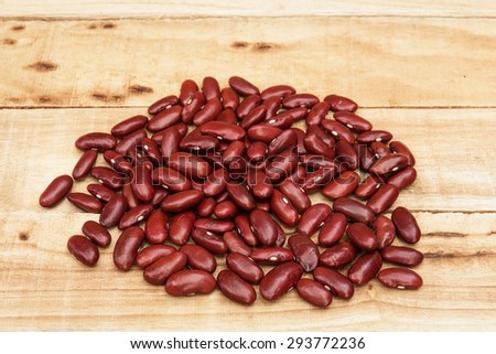 Red Kidney beans on wood table background. Protein nutrition.