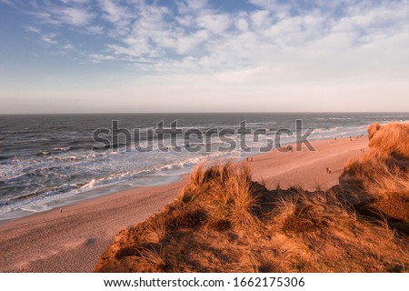 Similar – Foto Bild Rotes Kliff an der Küste der Insel Sylt bei Sonnenuntergang.  Leere Strandkulisse an der Nordsee