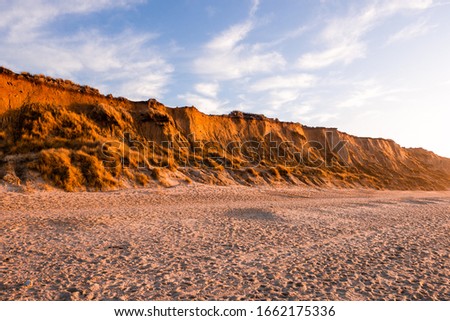 Similar – Foto Bild Rotes Kliff an der Küste der Insel Sylt bei Sonnenuntergang.  Leere Strandkulisse an der Nordsee