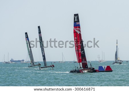 PORTSMOUTH, UK - JULY 25: The Team Emirates, Land Rover BAR, and Groupama America\'s Cup boats sailing in the America\'s Cup World Series in Portsmouth shown on July 25, 2015 in Portsmouth, UK