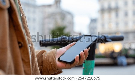 Similar – Image, Stock Photo Activating electric scooter from smartphone