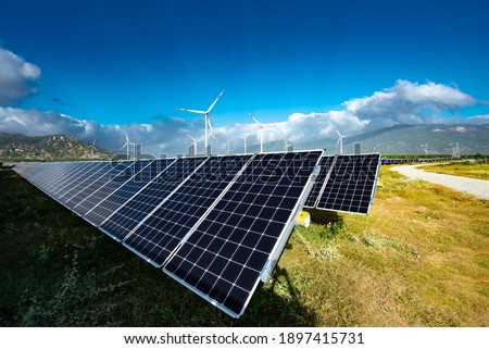 Solar panels farm under the sky. Blue solar panels. Background of photovoltaic modules for renewable energy clean energy green energy to prevent climate change and global warming