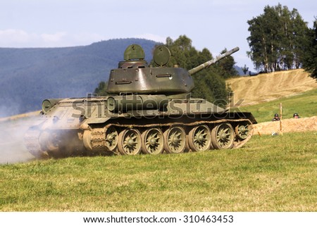 old military tank in combat