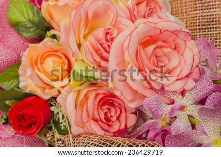 Rose fake flower and Floral background. Lot of artificial flowers in colorful composition