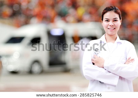 Smiling medical doctor woman Asia with stethoscope on ambulance car background