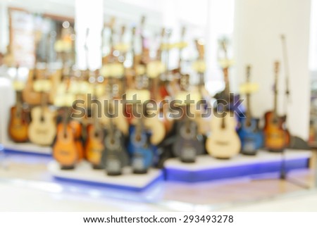 blurry of guitar for sale at supermarket/mall