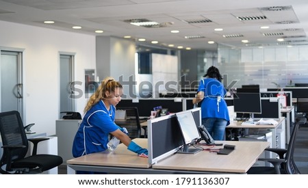 Cleaners clean empty office space photo