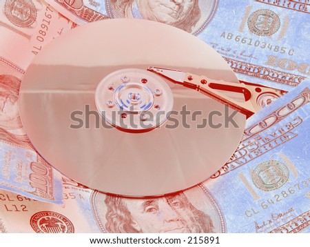 A hard drive platter surrounded by money. Signifying the high cost of storage and bandwidth