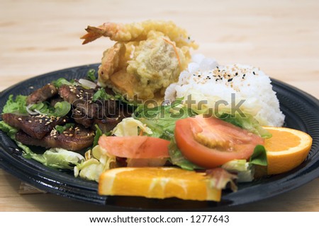 Combo MisoYaki Chicken combo plate with tempura shrimp, tempura vegetables and an Asian soy ginger salad, steamed rice and oranges
