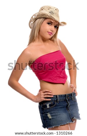 Beautiful young cowgirl with blond hair in a short denim skirt, pink top and cowboy hat
