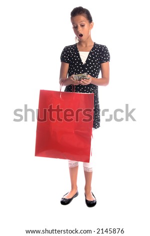 Twelve, 12 year old girl with a big red shopping bag with an amazed expression at the loads of cash she has saved
