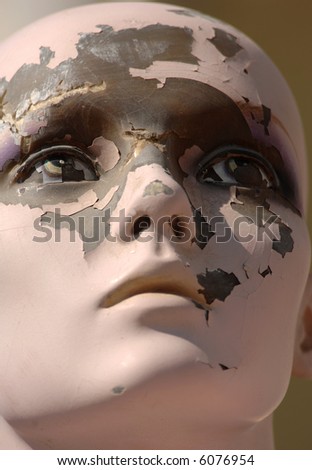 Deteriorating face of a once regal mannequin