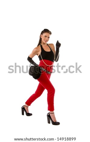 Retro pinup dancer / model in red high waisted jeans, black tank top, top hat high heel Mary Jane shoes and a strand of white pearls