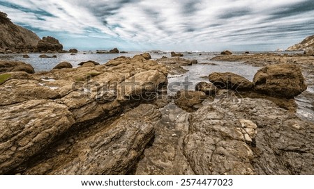 Similar – Image, Stock Photo Stony seashore and waves at beautiful sunset