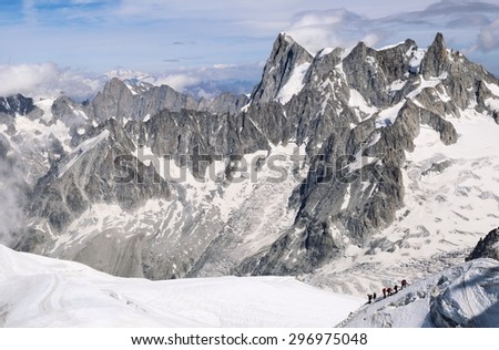 France, mountain landscape, groups of tourists climbing Mont Blanc