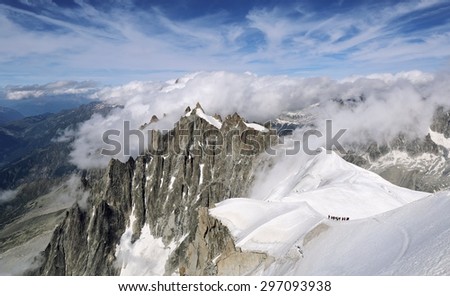 France, mountain landscape, groups of tourists climbing Mont Blanc