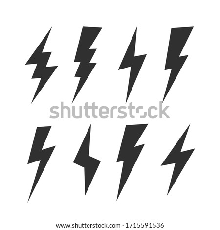 Set of 8 Lightning flat icons. Thunderbolts icons isolated on black background. Vector illustration Stock fotó © 
