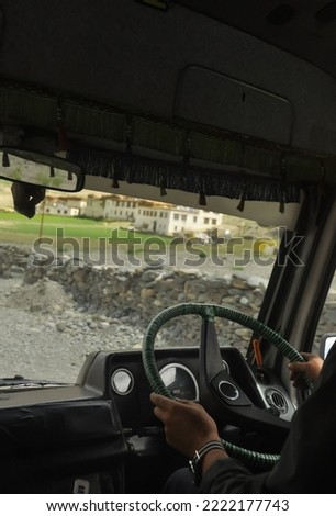 Similar – Image, Stock Photo Unrecognizable traveler between rough mountain and foamy sea