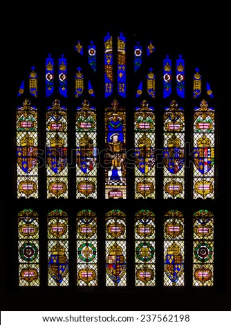 HAMPTON COURT, SURREY, UK - MAY 21, 2014: Stained-glass window symbolyzing Henry VIII\'s royal power.