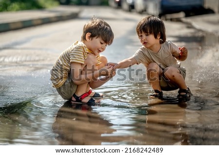 Similar – Image, Stock Photo Boy kid walking on wet sunny beach